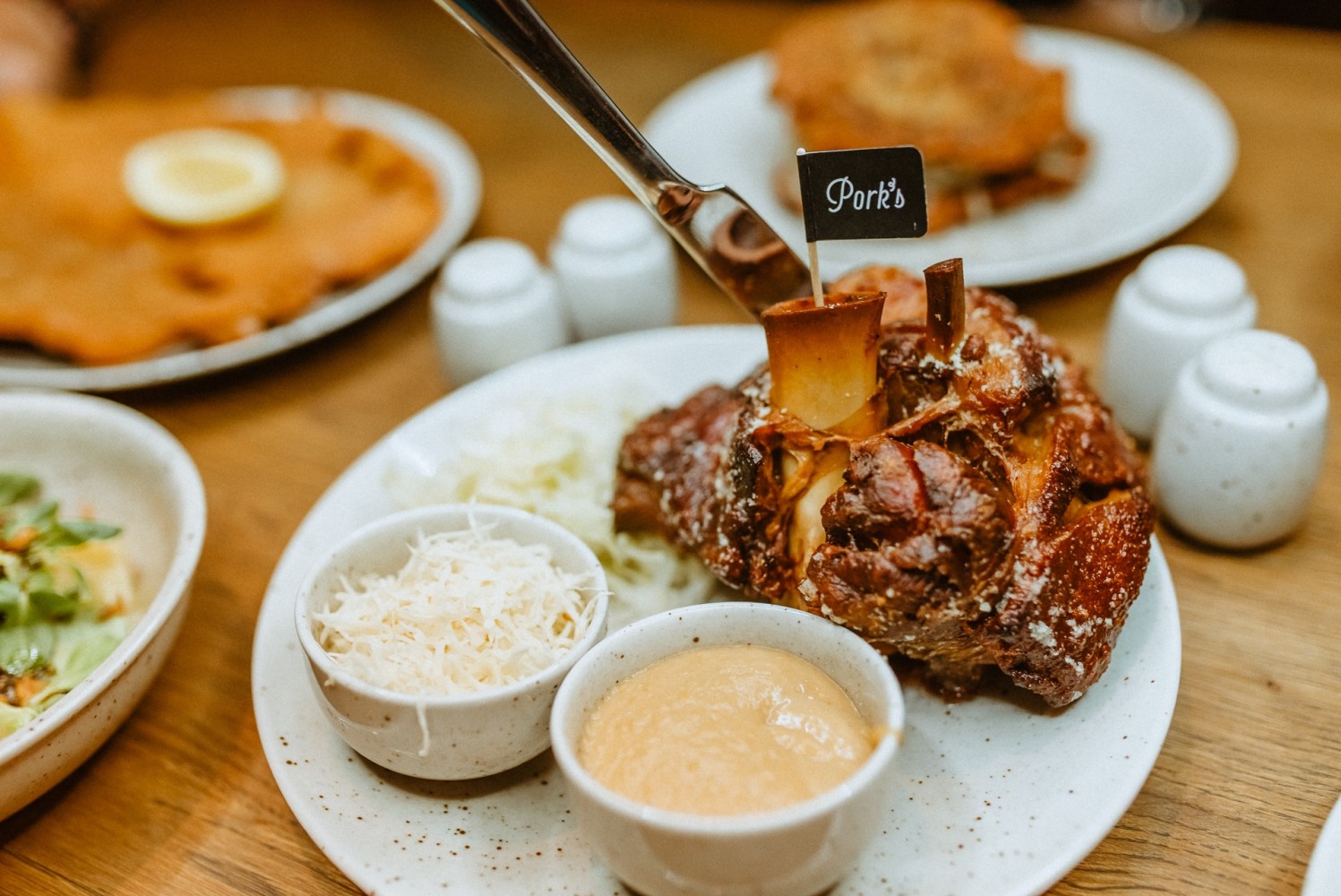 a close-up of a delicious traditional Czech dish of roasted pork knuckle that you can try on our Old Town Food Tour in Prague or on your own in the popular Pork's restaurant in Lesser Town