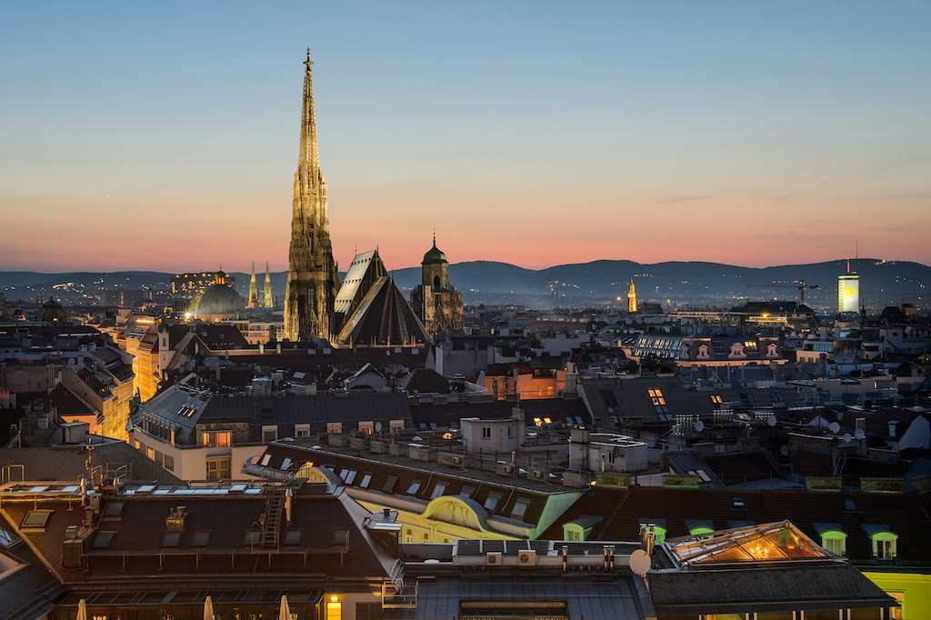 a panoramic view of Vienna just after sunset when the city awakens to its beaming nightlife