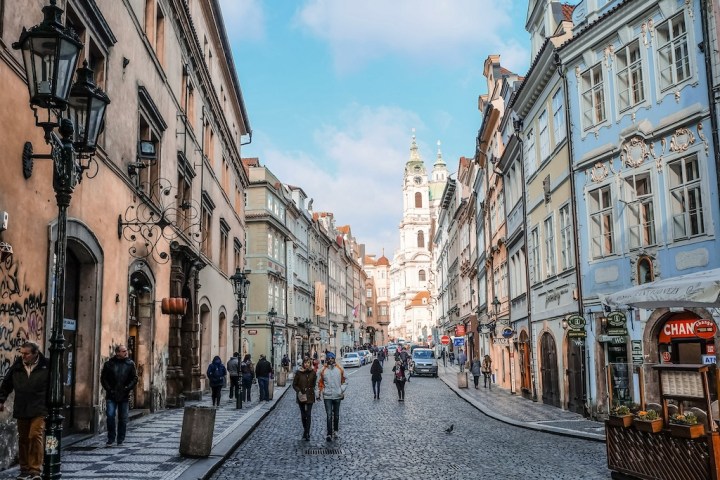 looking down a cobblestone street in the historic center of Prague